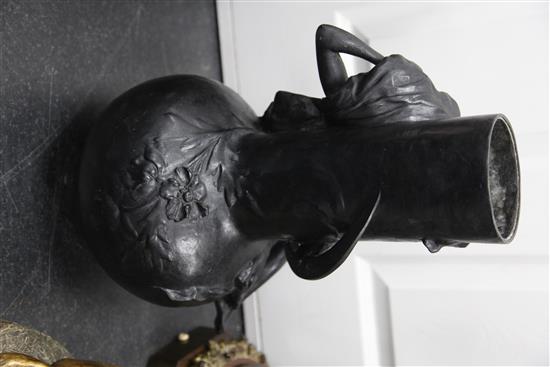 A pair of Art Nouveau black painted metal figural vases, both 18in.